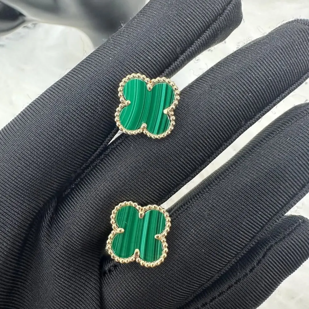 VC — Clover motifs in hand-set stone